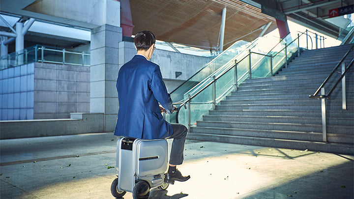 No need to walk at the airport, hop on your motorized luggage with Airwheel!